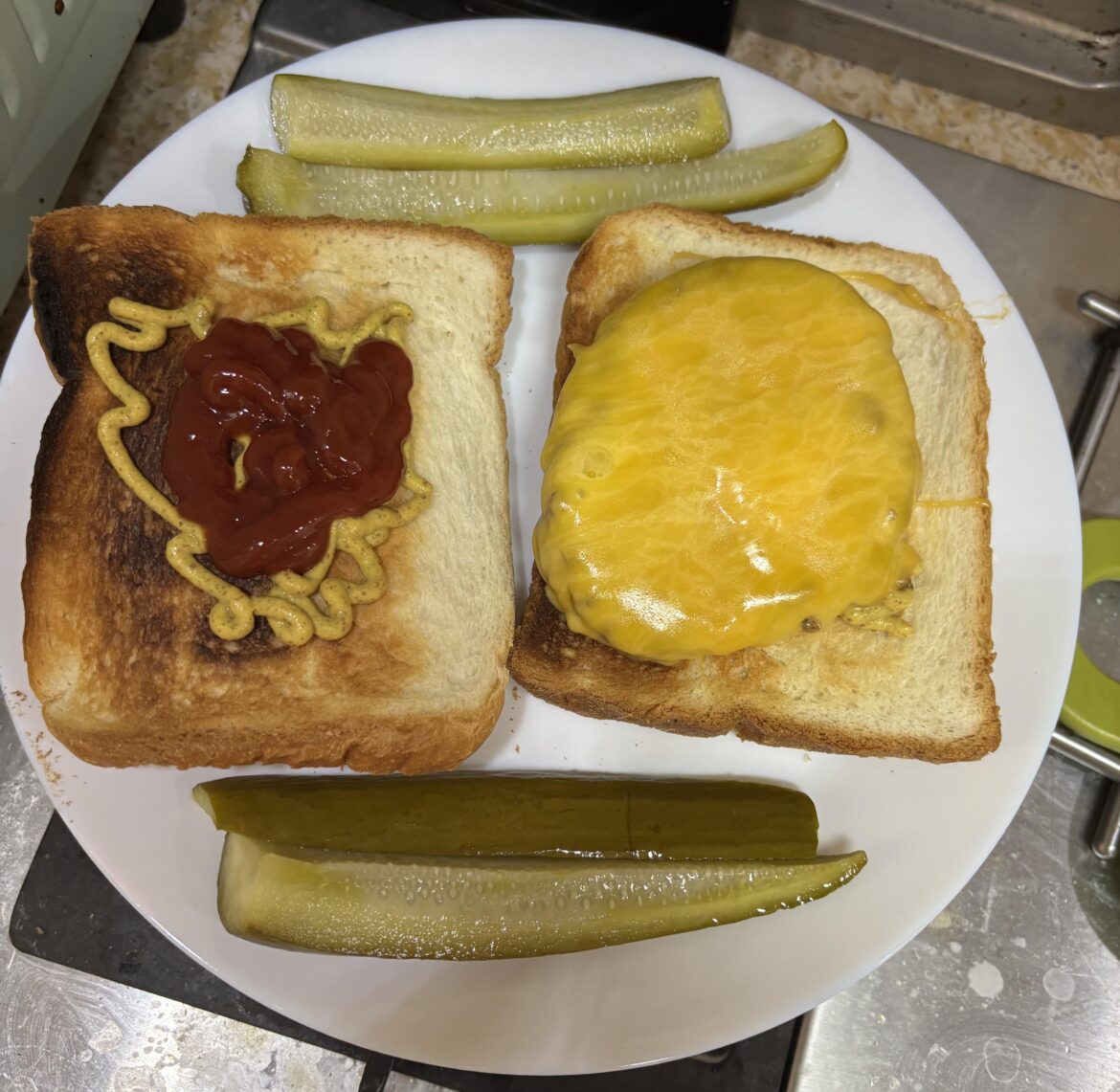 Lunch cheeseburger and homemade pickles for lunch.