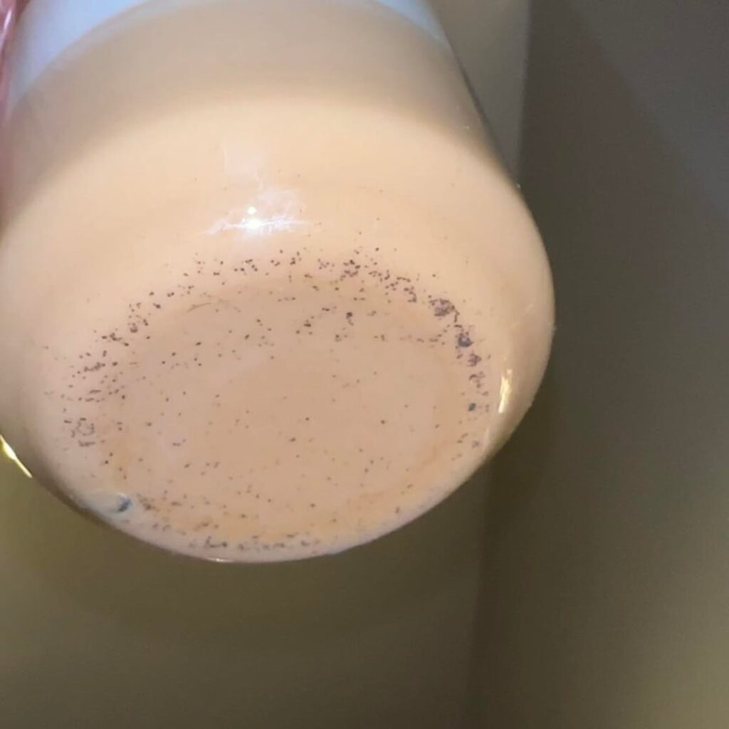 Small coffee grounds in coffee