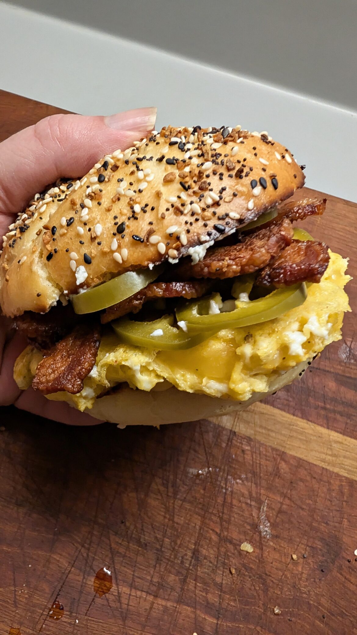 Eggs, bacon, Gouda cheese, pickled jalapenos on an everything kaiser roll