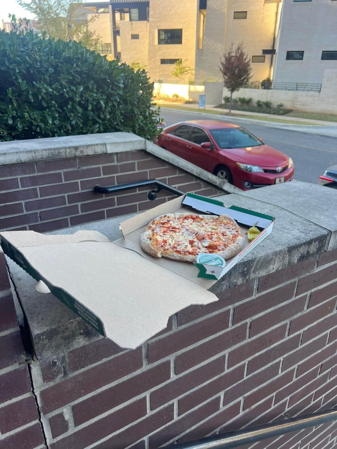 Second time someone's left a pizza on the stoop.