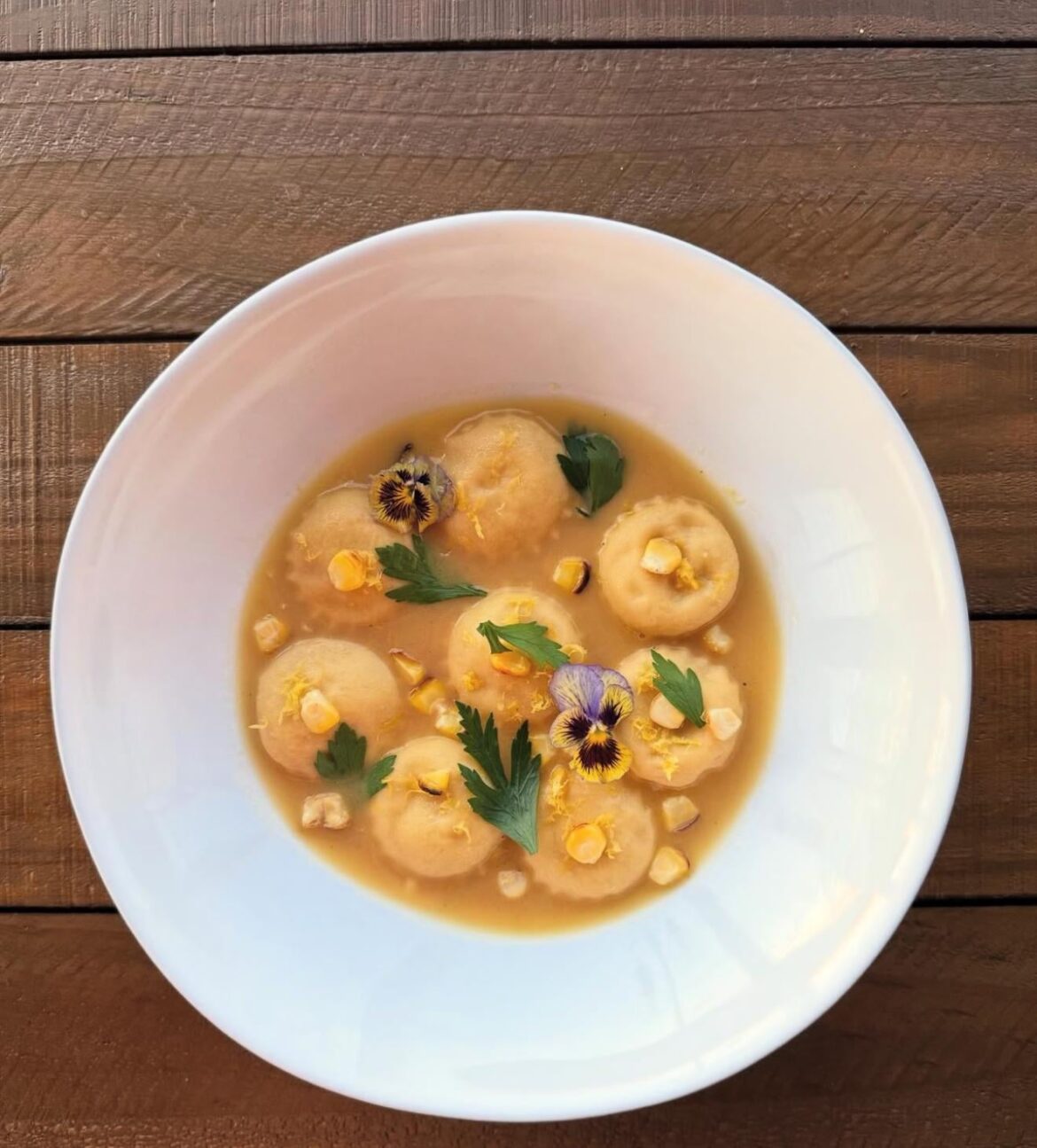 Scamorza & charred corn ravioli in golden corn broth