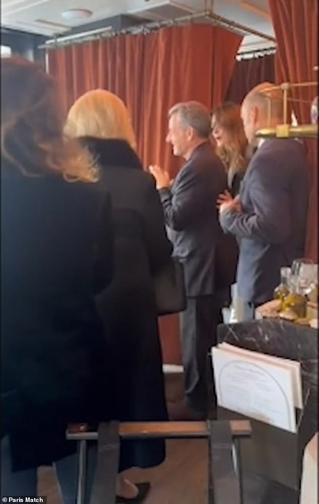 The former French President Nicholas Sarkozy and his wife received a round of applause as they left the Le Flandrin restaurant in Paris on Tuesday