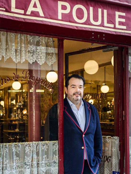 chef Jean-François Piège stands in the doorway of restaurant  La Poule au Pot