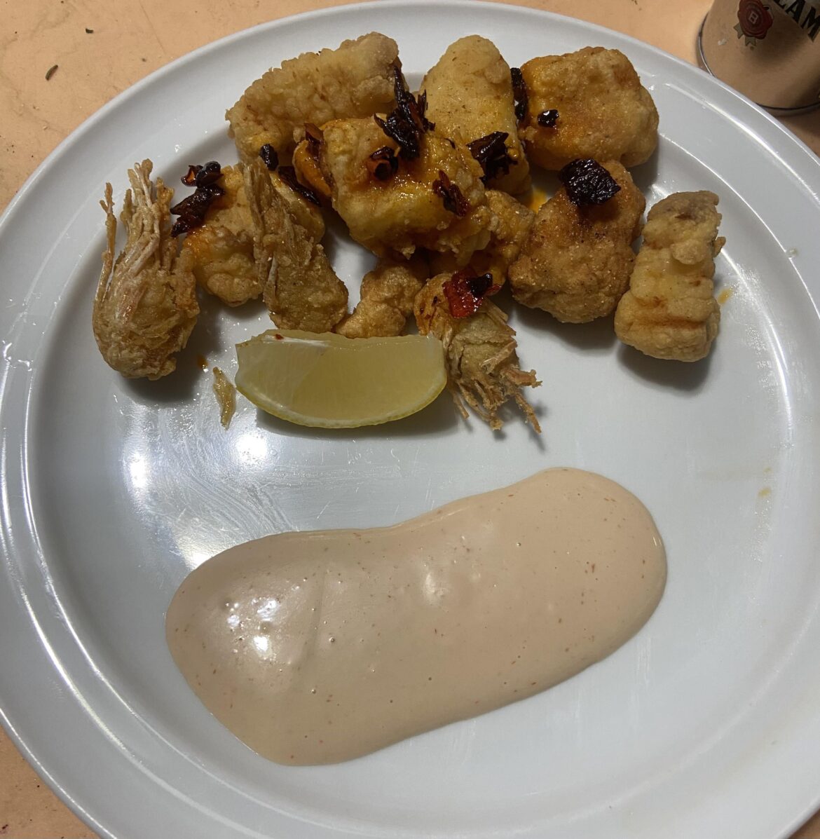 Fried alligator gar and sea spiders, with chili crisp and a chipotle béchamel  sauce.