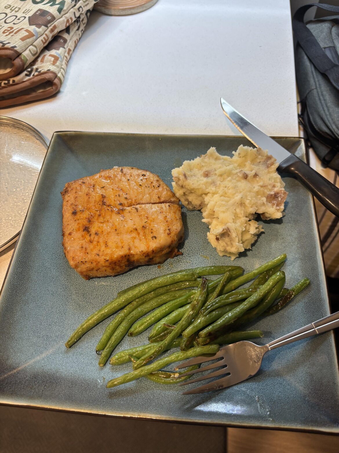 Pork chop with mashed potatoes and green beans