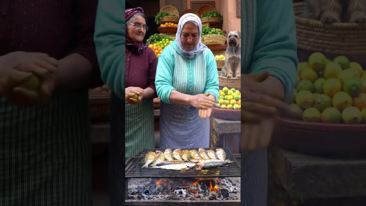 ​ “Moroccan Grandparents with Dog Cooking Grilled Sardines in Market” #food #worldvillagecookery