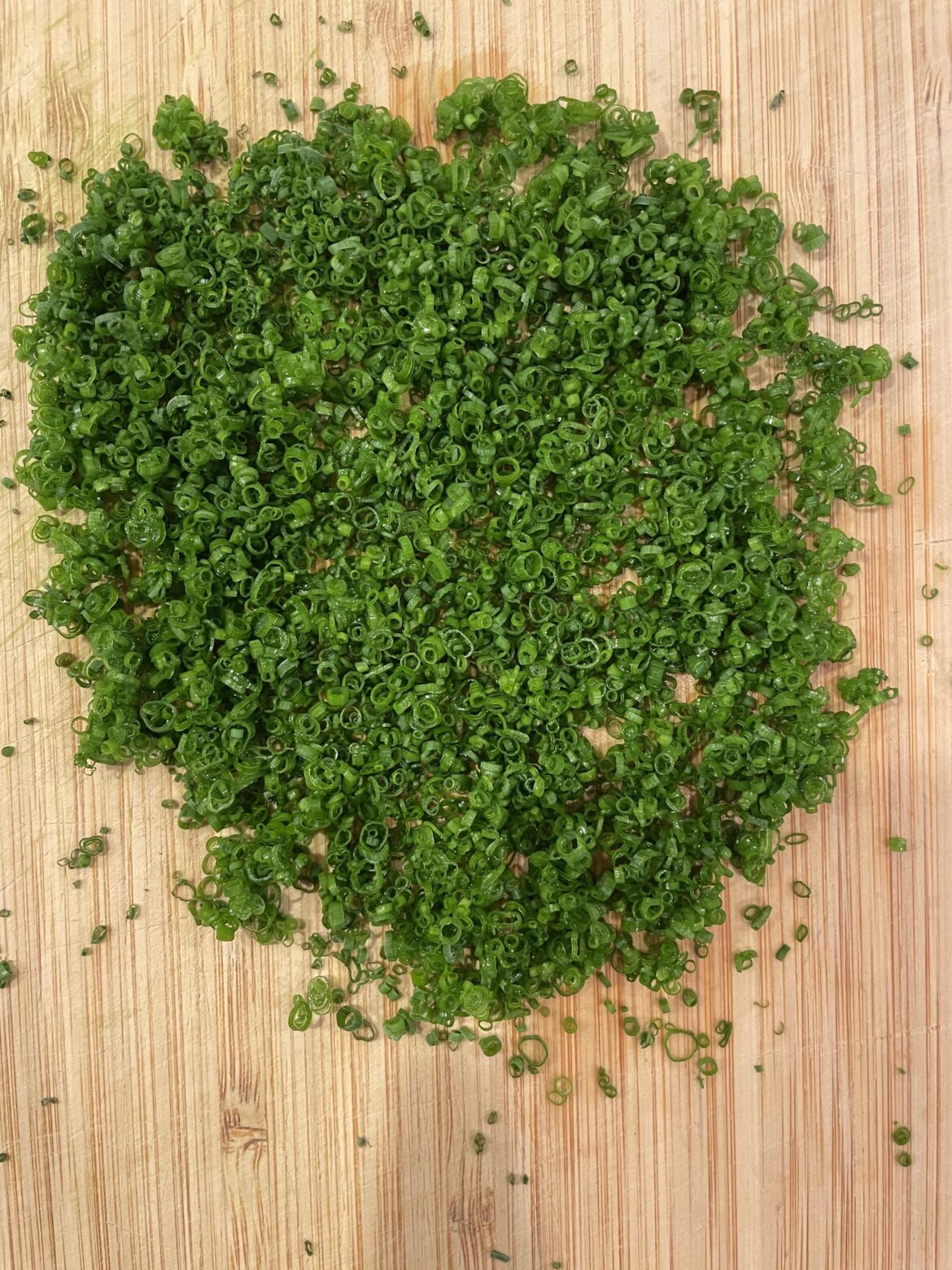 Cutting a couple of chives almost every day until this reddit says they're perfect. Day 44