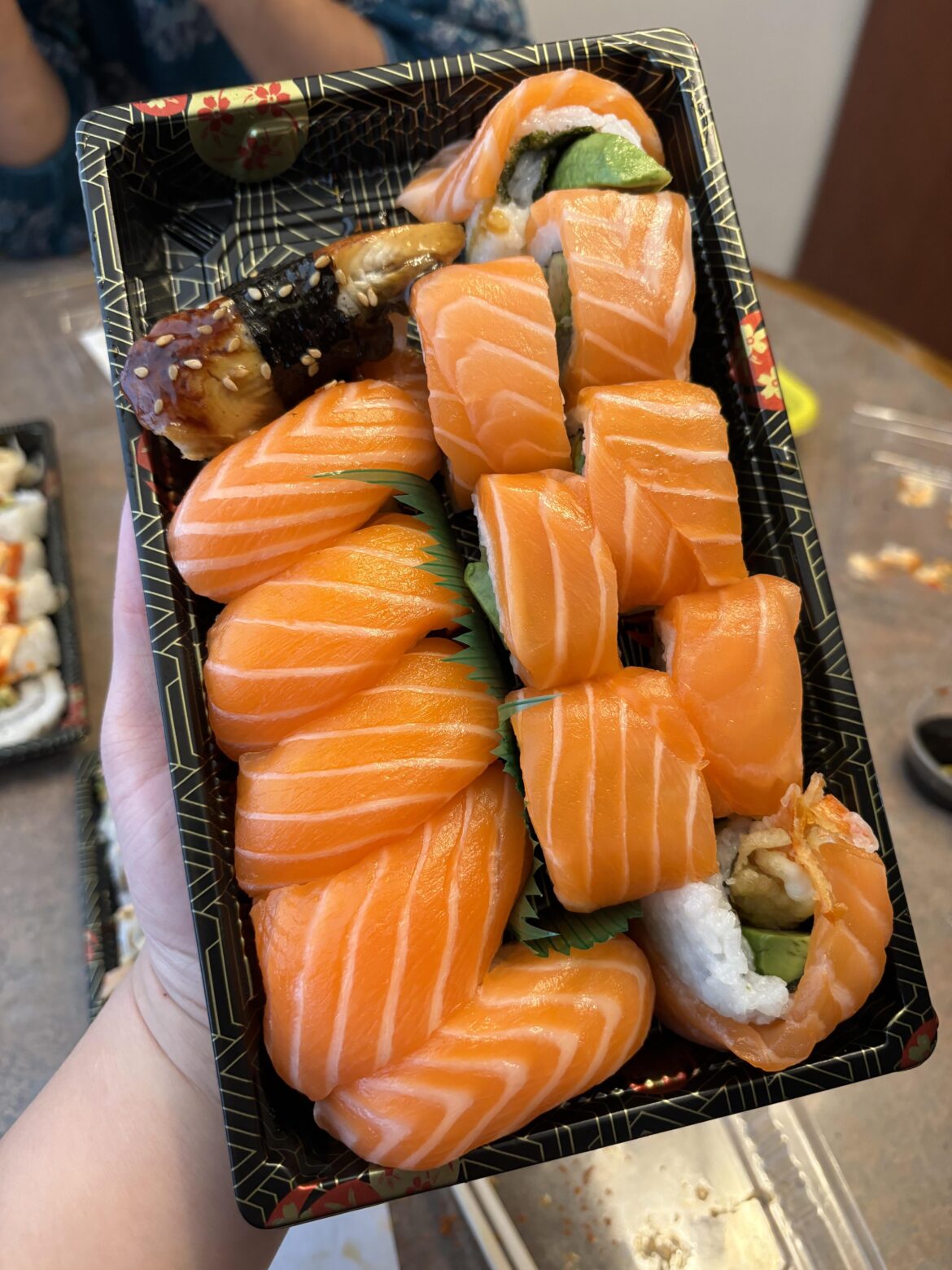 Salmon sushi with a random unagi