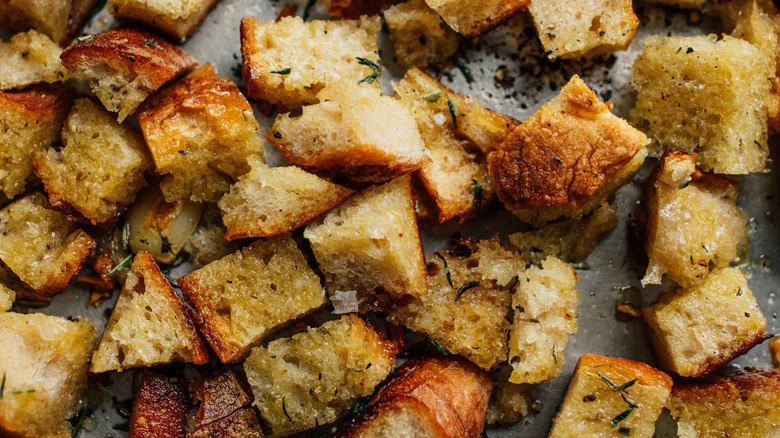 Homemade croutons on baking sheet