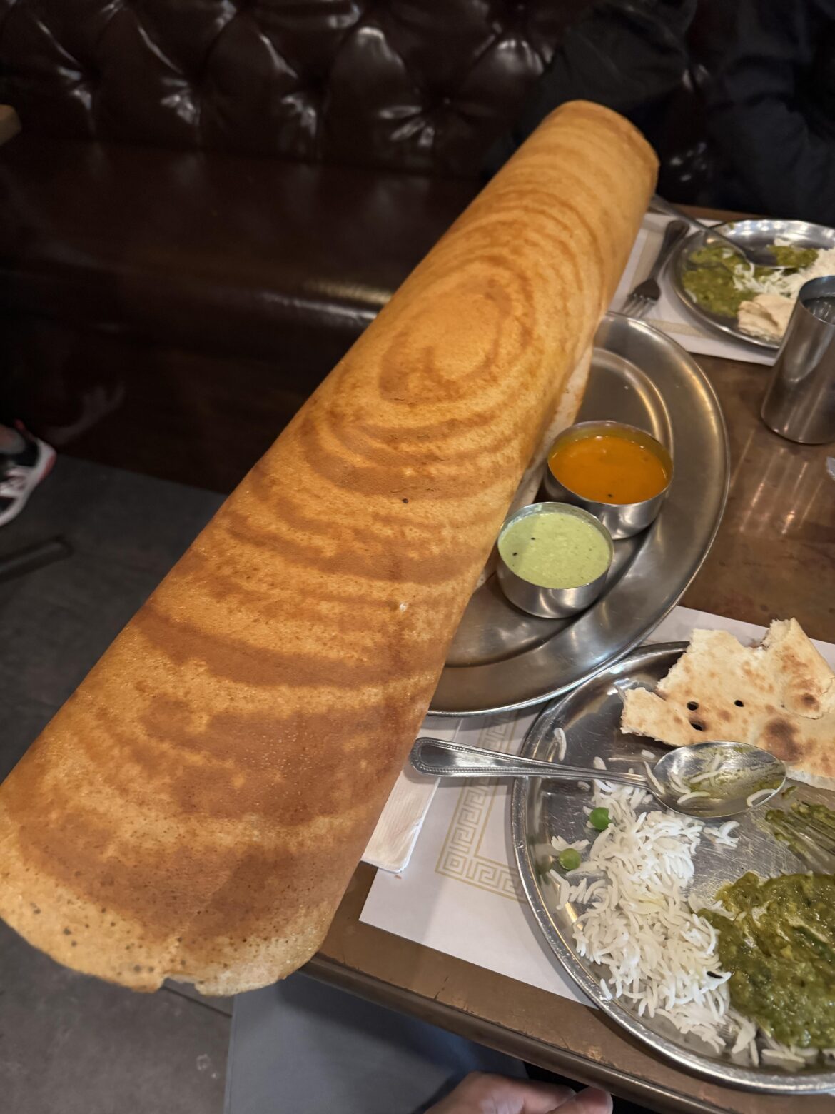 This paper masala dosa is the length of the table (Dosa Delight)