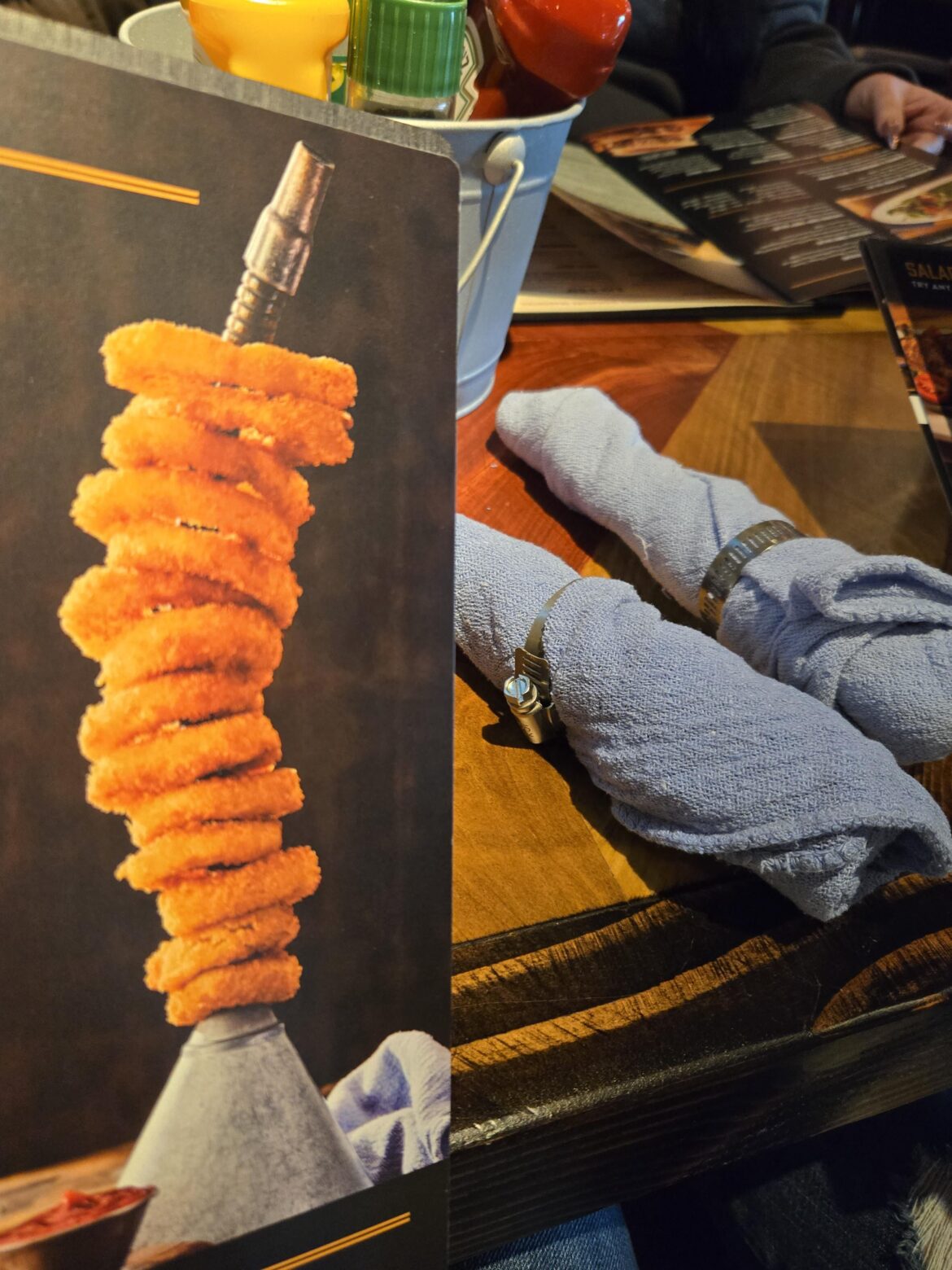 A funnel of rings, shop cloth napkins, and hose clamp napkin rings. First post on this sub.