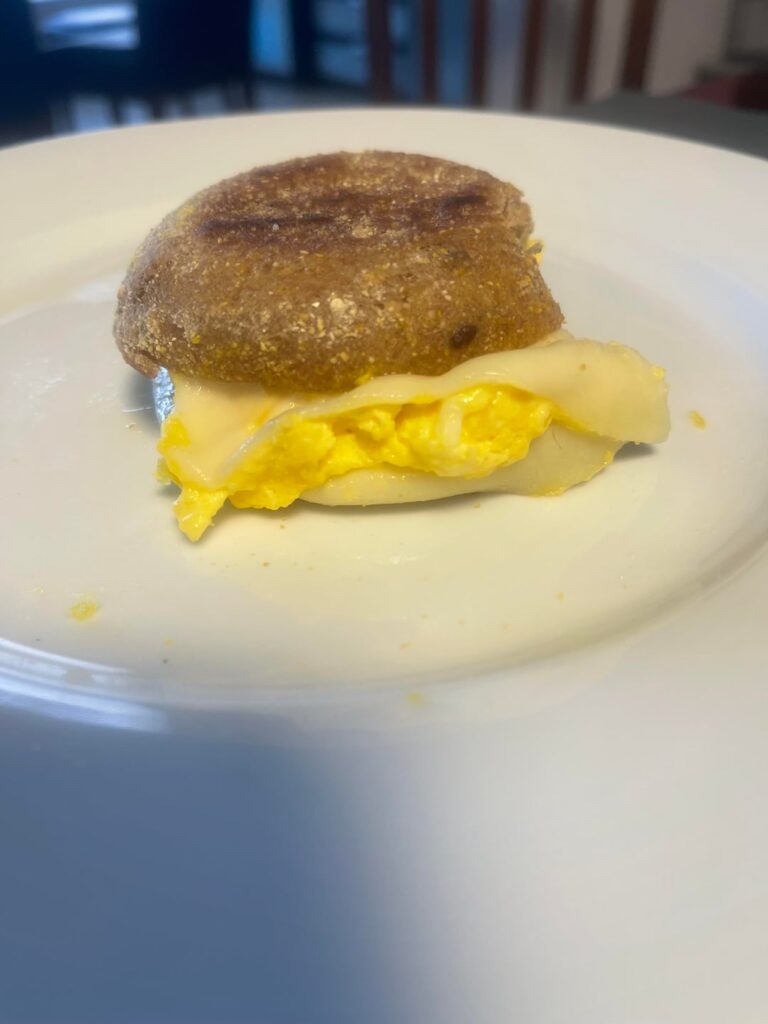 Eggs and provolone on toasted English muffin