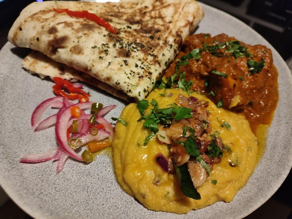 Homemade dhal, tikka curry and pickled onions and chillies