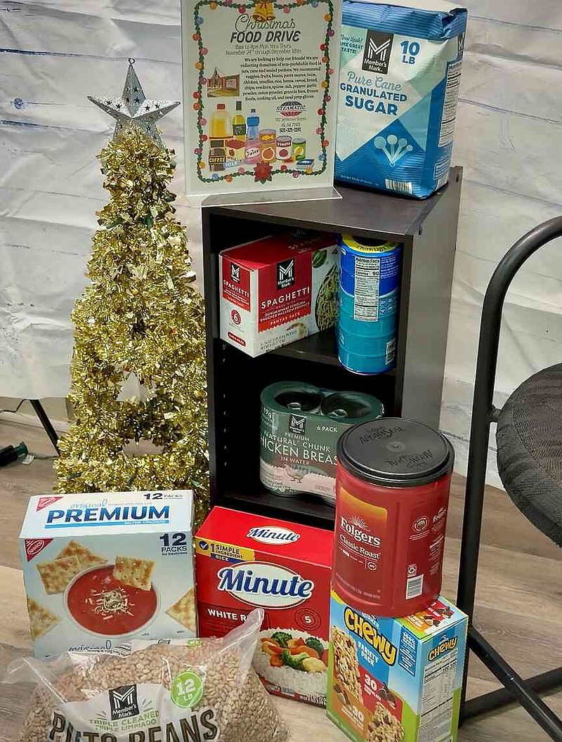 Recently donated food items for this year's Christmas Food Drive are shown at Steamatic of Hot Springs, 112 Jefferson St., on Wednesday. (The Sentinel-Record/Brandon Smith)