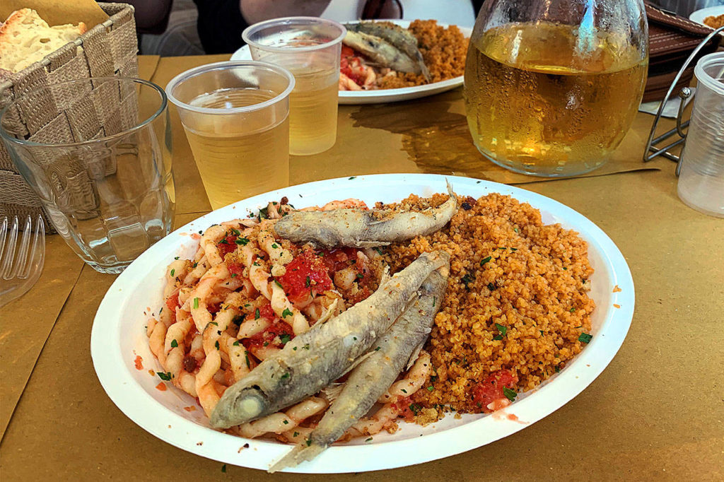 Even on the small island of Sicily, you’ll find regional specialties, such as fish couscous and Busiate alla Trapanese, a twisty pasta with red pesto. (Carrie Shepherd / Rick Steves’ Europe)