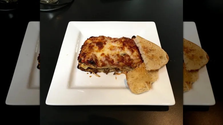 Lasagna with slices of toast