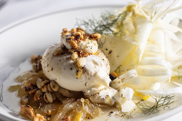 Burrata served over sweet-tart fennel marmellata with pine nuts and coriander seeds.