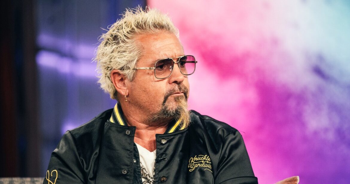 Guy Fieri says his leg 'exploded' after he fell down stairs on set, is now in wheelchair