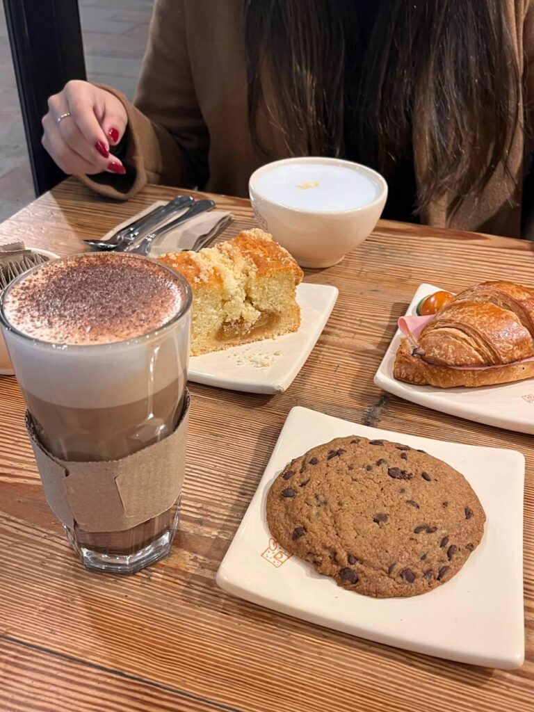 Crumb cake, croissant with a layered hot chocolate and cappuccino