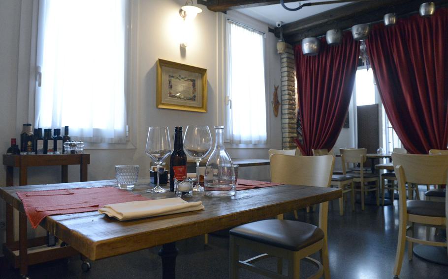 Osteria Turlonia in Fiume Veneto, Italy, has an indoor seating area spread out over several small dining rooms.