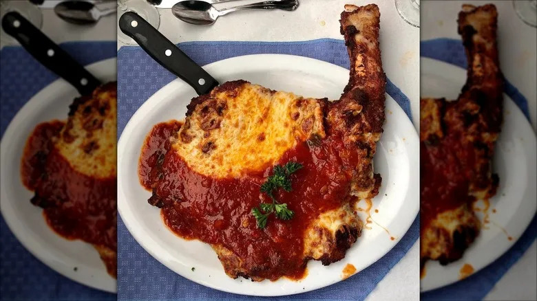 Veal chop parmesan on a plate