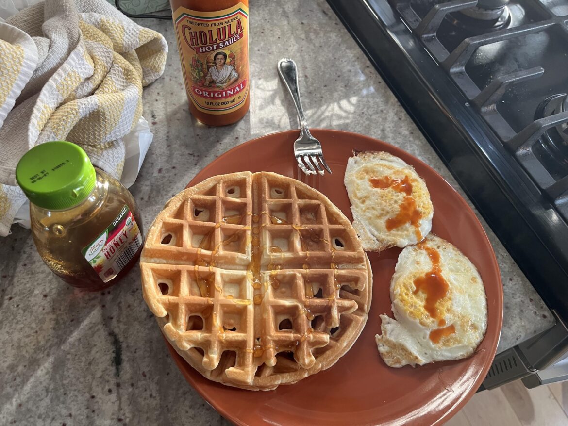 Birthday breakfast! Waffles and eggs, honey and Cholula respectively.