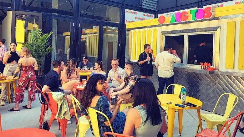 Colorful and lively diners at Omarcito's Latin Cafe