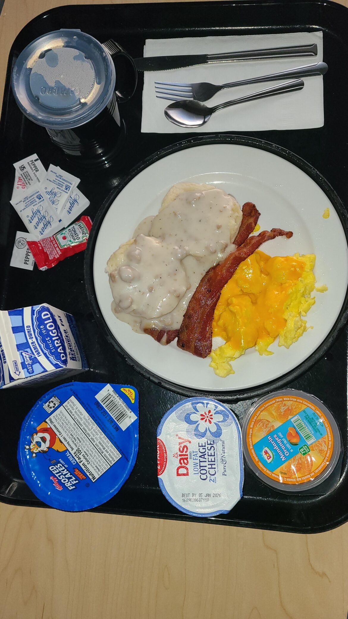 My choice for hospital food breakfast this morning while recovering from cancer surgery. Biscuits and gravy, scrambled eggs with cheese, bacon, frosted flakes, cottage cheese & mandarins slices
