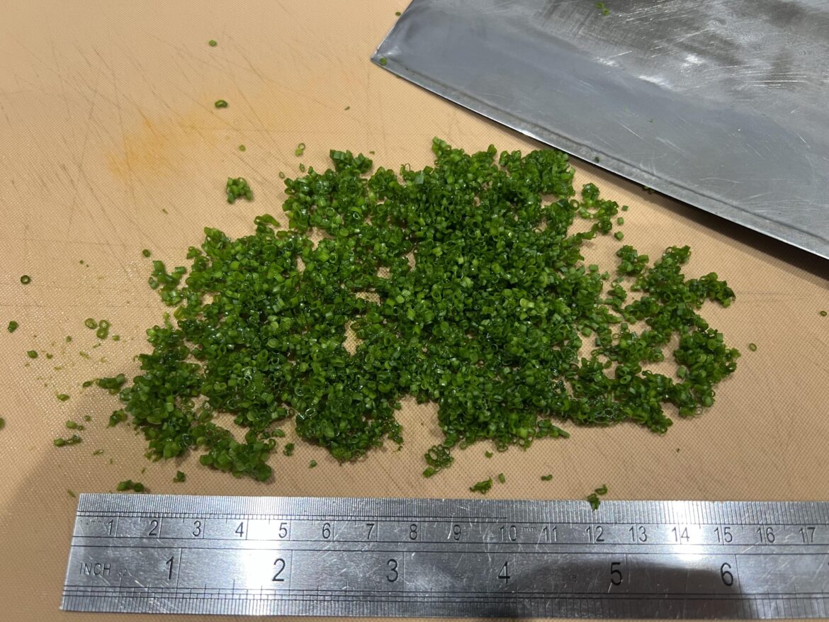 Cutting a few chives and I don’t care if they’re perfect because they’re for tonight’s dinner at home.