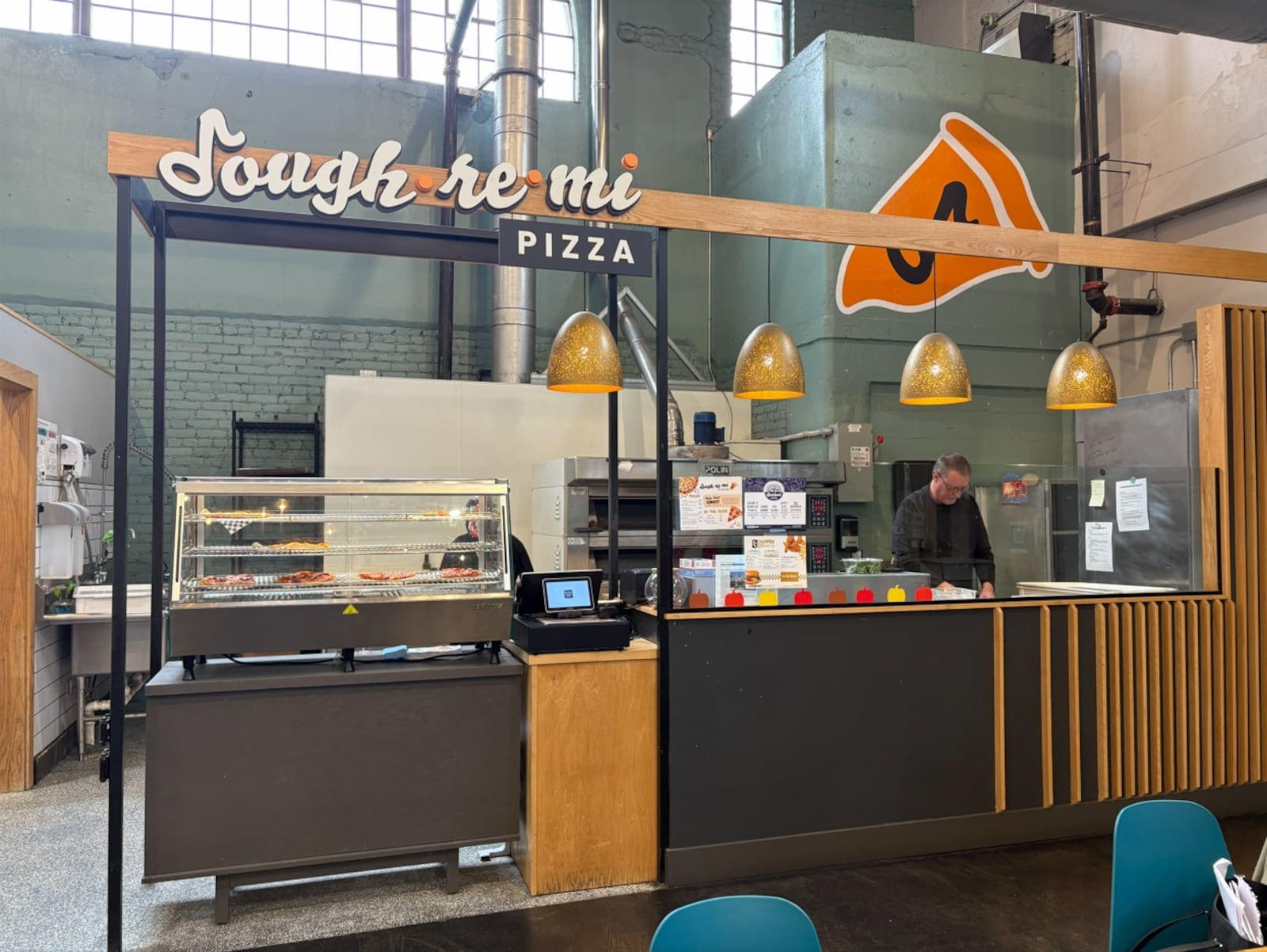 Dough Re Mi Pizza inside Myers Market in Springfield. Brooke Spurlock/Staff