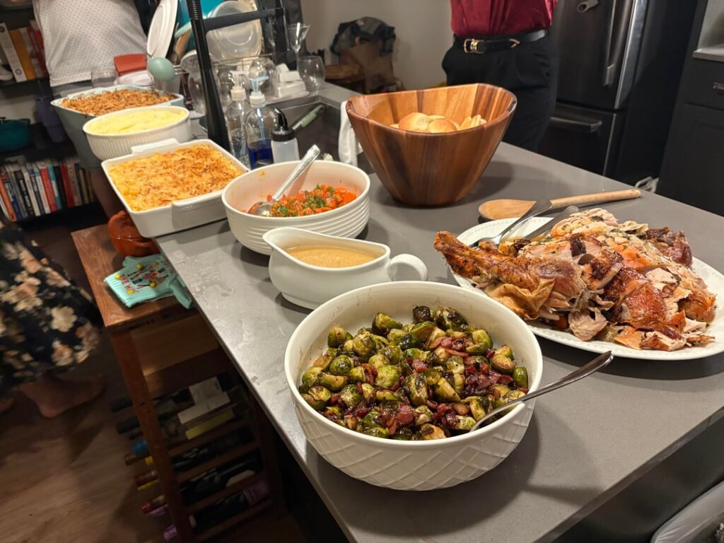 Nervous to share, but cooked Friendsgiving spread for my pals - turkey, gravy, taters, sprouts, gb casserole, Mac, rolls, carrots