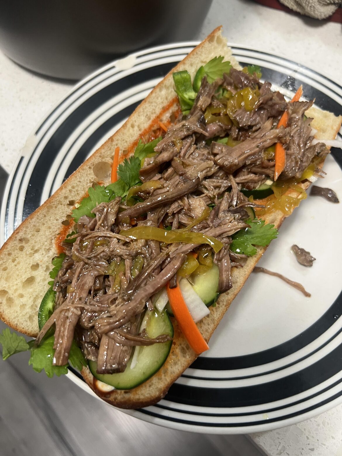 Mississippi pot roast on a bahn mi