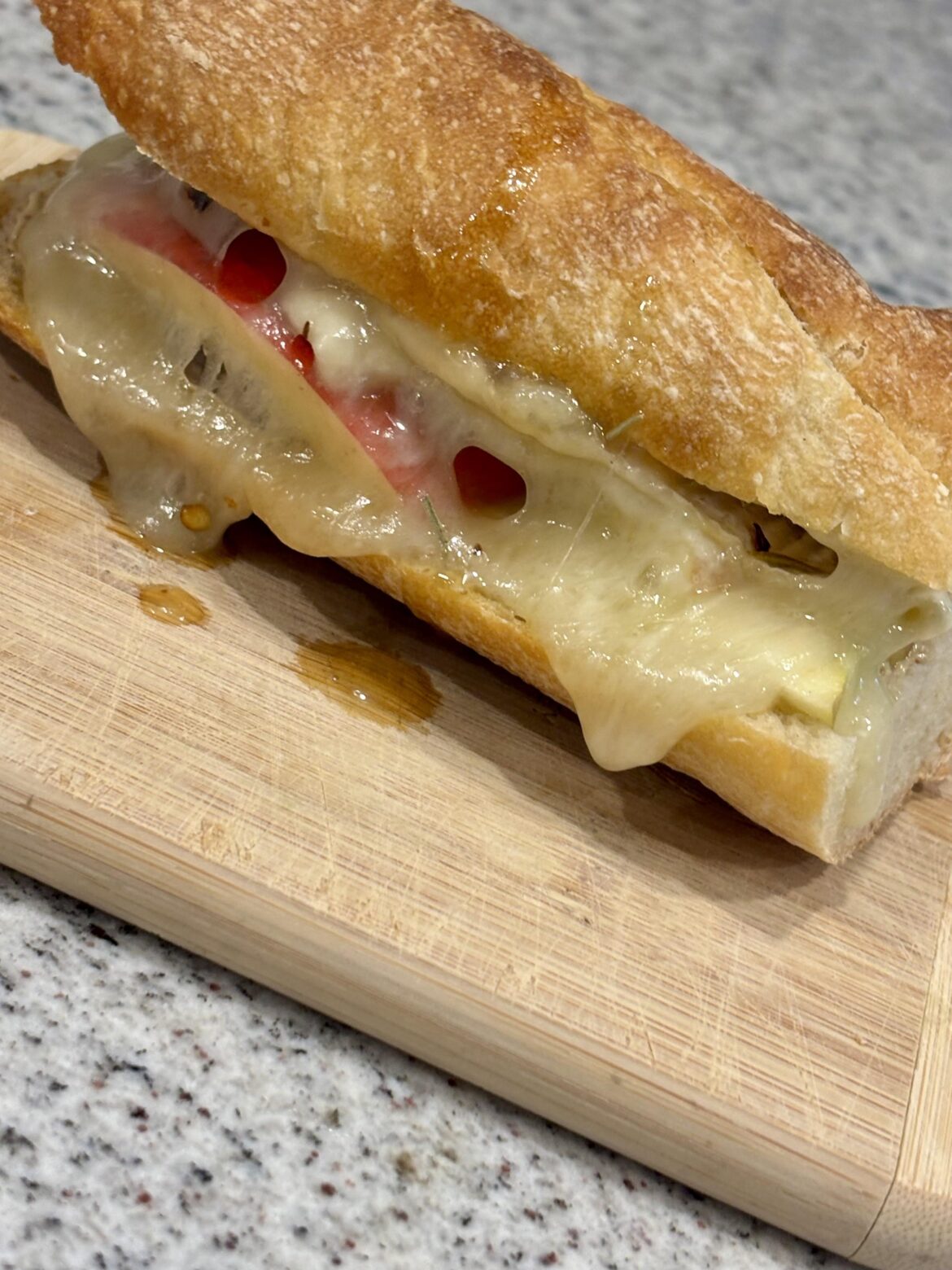 Simple Sammie: baguette, melted brie with honey/chili/rosemary, stone ground mustard, apple slices.