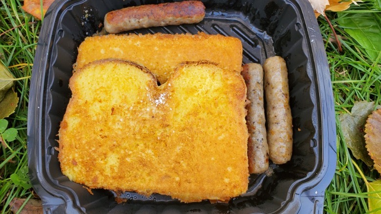 Bob Evans French toast and sausage links in a black plastic tub