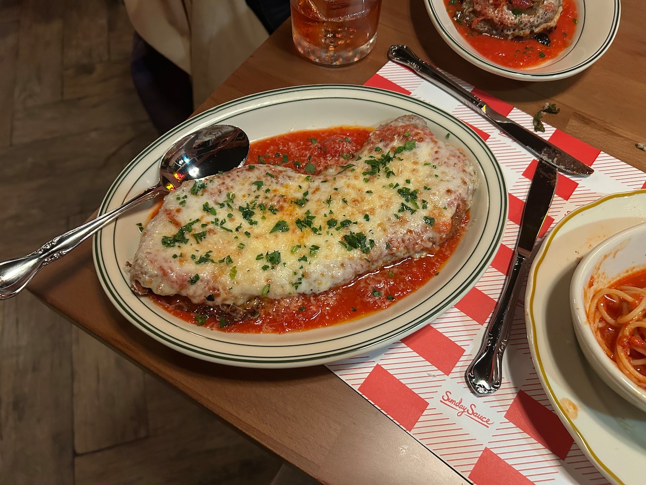 A crunchy chicken Parm with browned mozzarella in a thin tomato gravy at North Portland's new Sunday Sauce.
