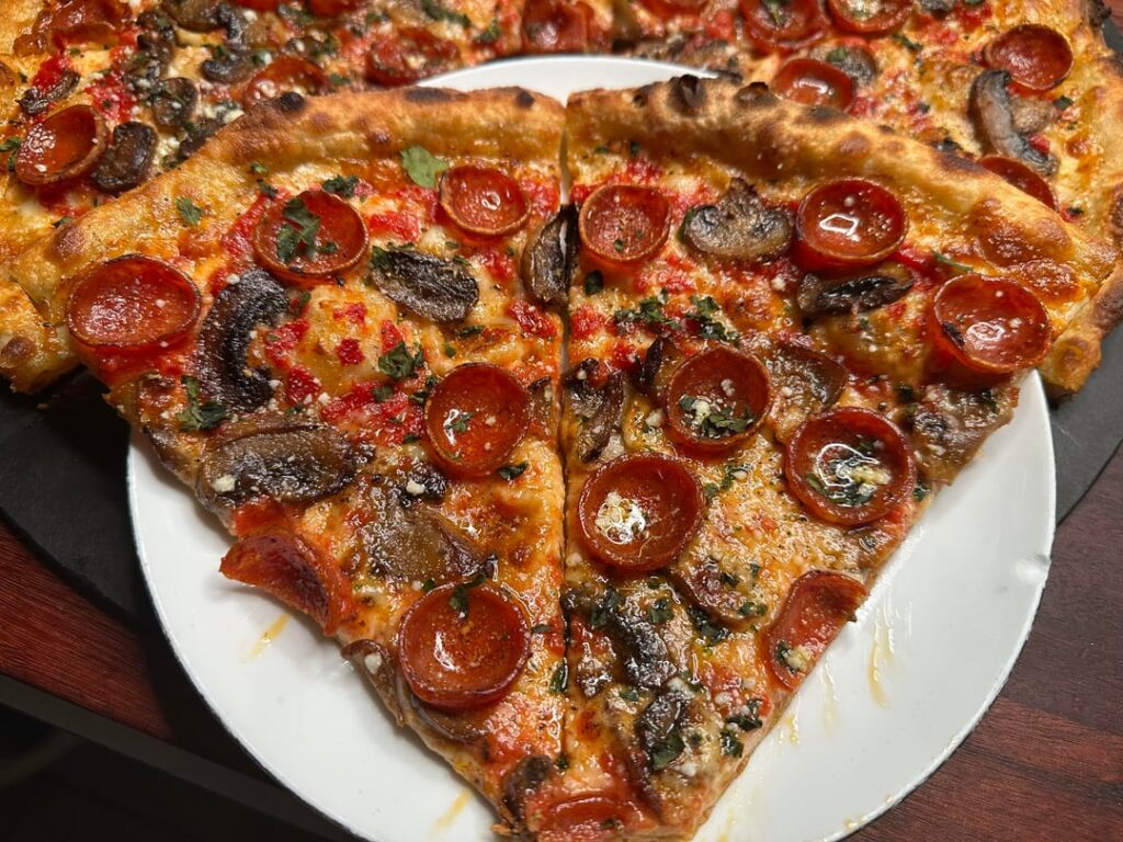 Homemade pepperoni and mushroom pizza