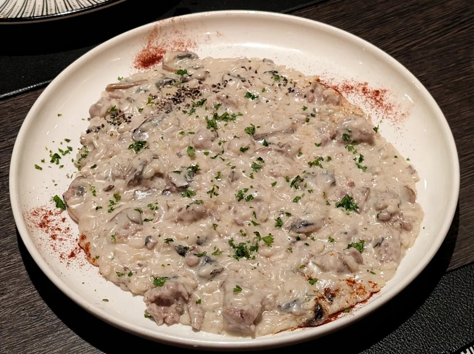 The ‘risotto salsiccia e funghi’ is so rich and thick it can be eaten off a flat plate with ease. — Photo by Ethan Lau