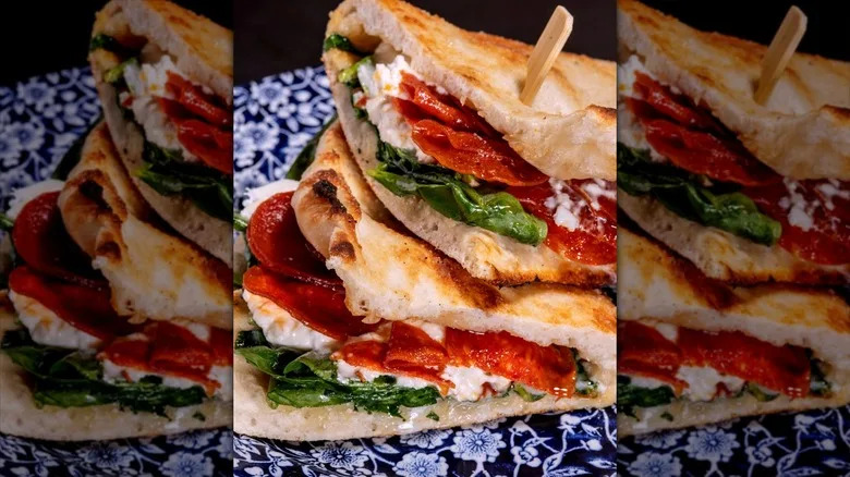 Sandwich stuffed with burrata and pepperoni