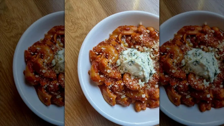 Red sauce paste topped with ricotta