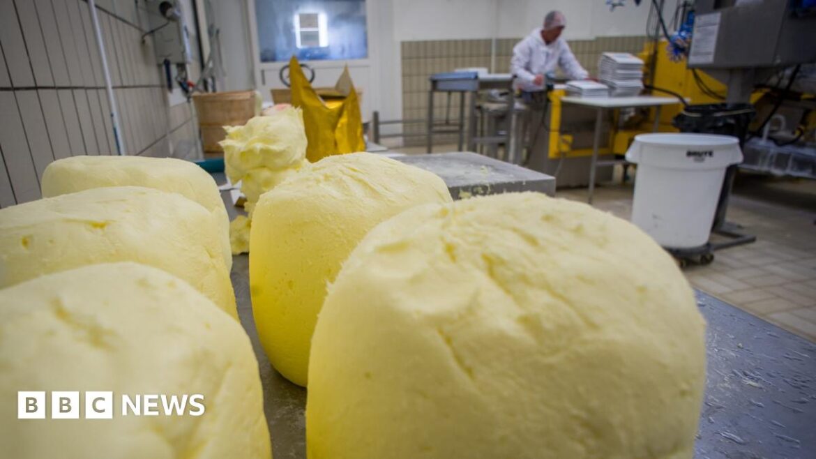 Is there a butter crisis in France? Large balls of butter on a worktop in a dairy