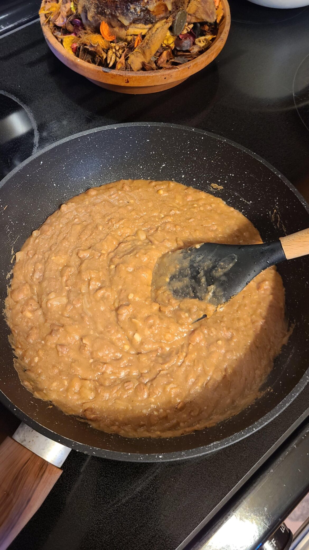 Cooking what you can. Canned Pinto beans turned into quick refried beans to have with dinner.