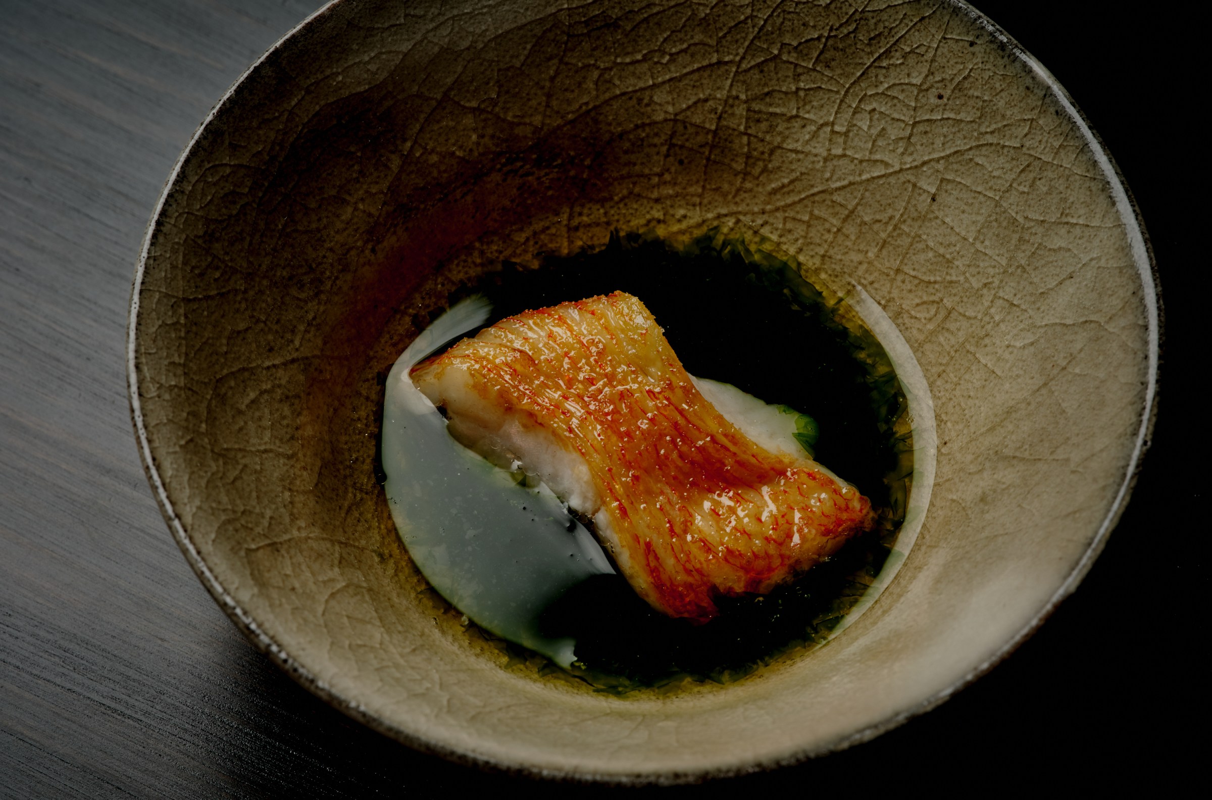 Kinki fish in a shallow pool of fish bone broth