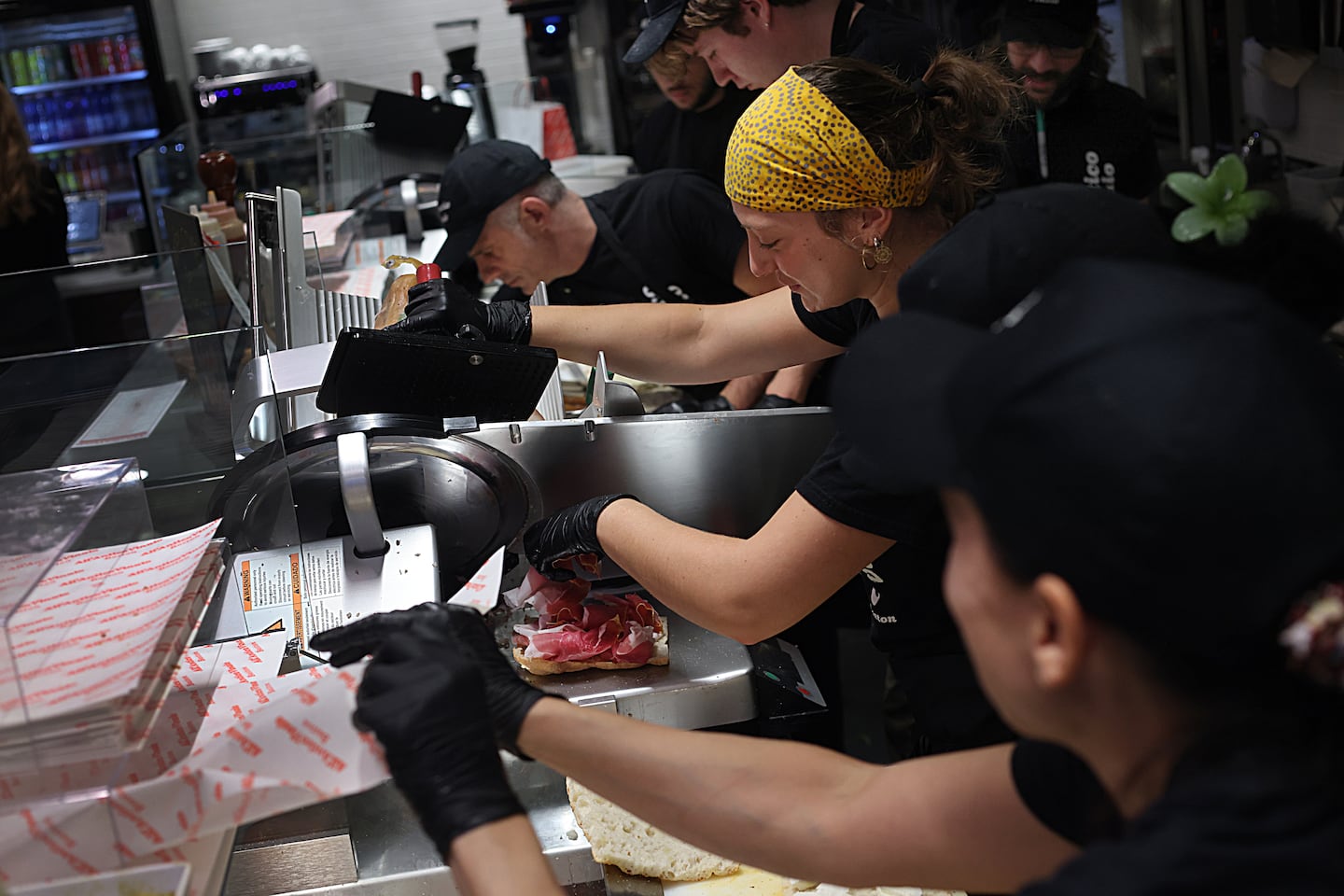 The staff makes sandwiches at  All'Antico Vinaio.