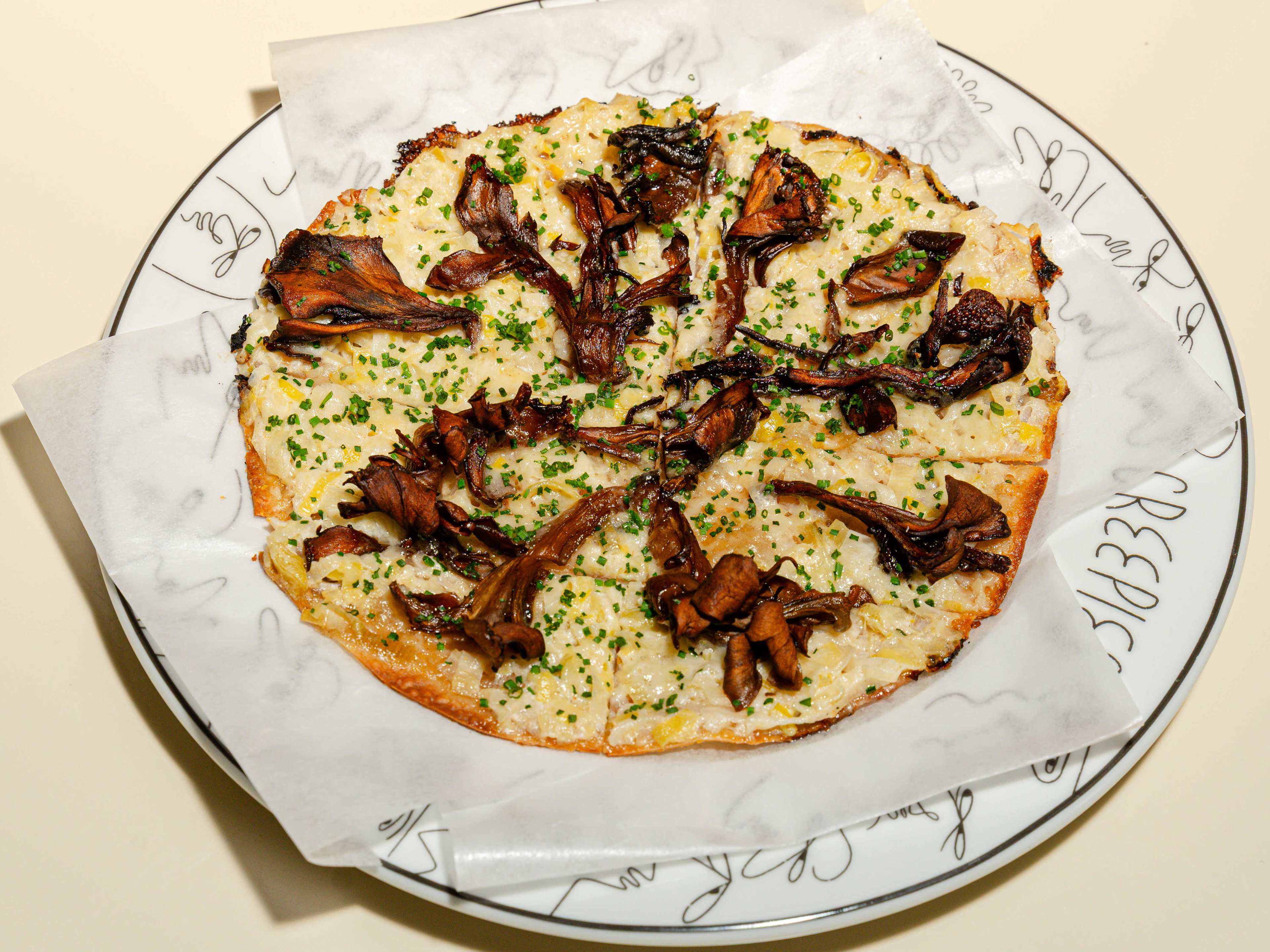 A plate of tarte flambe.