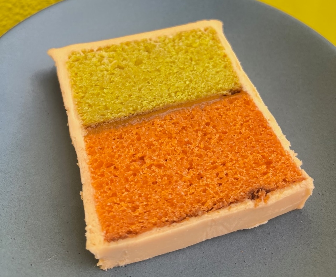 Rectangular orange and yellow cake slice