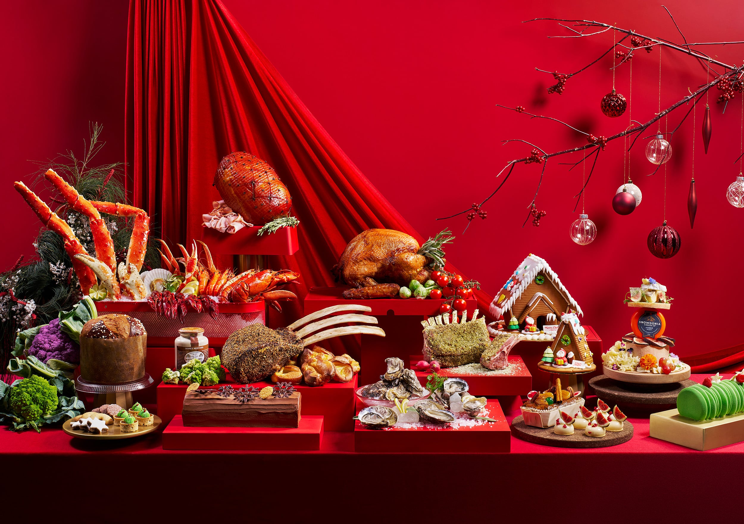 Lavish Christmas buffet at Edge, Pan Pacific Singapore with seafood towers, roast turkey, log cake, and festive desserts on vibrant red backdrop.