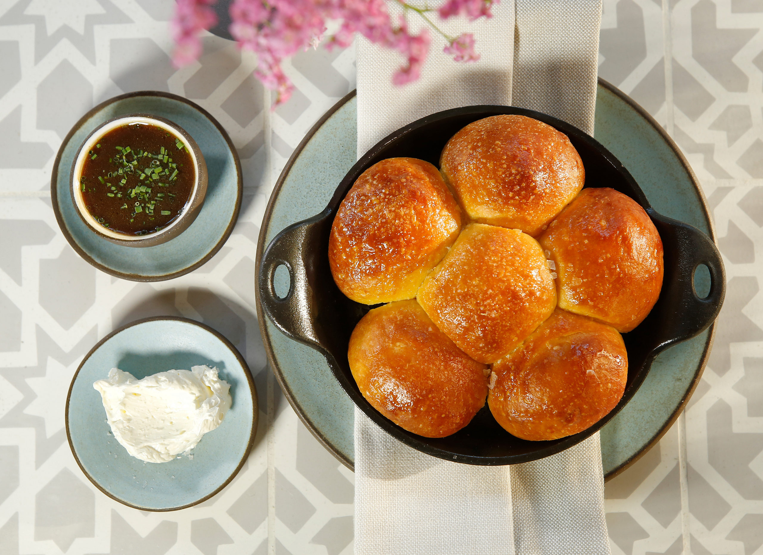 Parker House rolls in a skillet, served with chicken drippings, at Layla restaurant in MacArthur Place Hotel in Sonoma on Wednesday, September 4, 2019. (Alvin Jornada / The Press Democrat)
