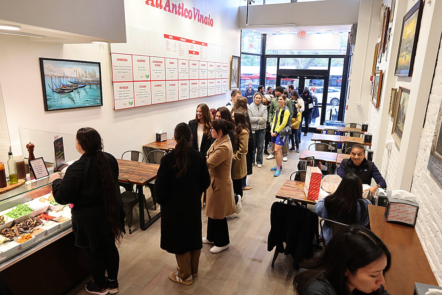 Where All'Antico Vinaio opens, a long line follows.