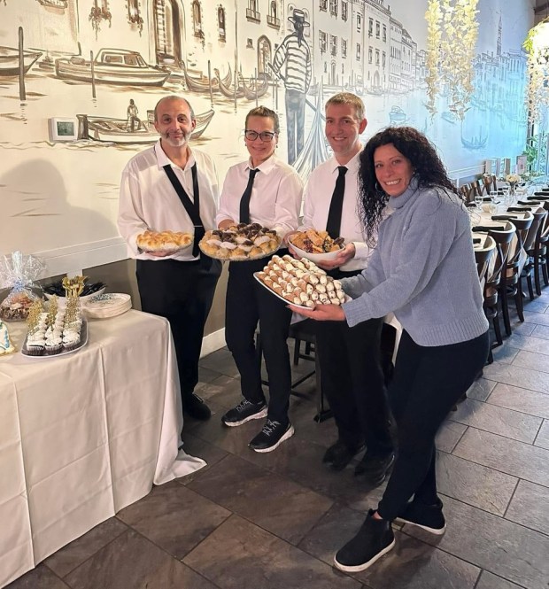 Angela Mamo, right is the owner of Piccolo Mondo Italian Restaurant in North Coventry Township. Mamo and co-owner Claudio Mamo announced plans to provide free kids meals for families experiencing a lapse in their SNAP benefits. Their announcement spurred several other restaurants to do the same: Giovanni's 724 Restaurant in North Coventry, The Pourhouse Pottstown and The Ice House in Pottstown. With Mamo in this photo left to right are Piccolo Mondo employees Steve, Jill and Adam Edwards, manager. (Courtesy Piccolo Mondo Italian Restaurant)