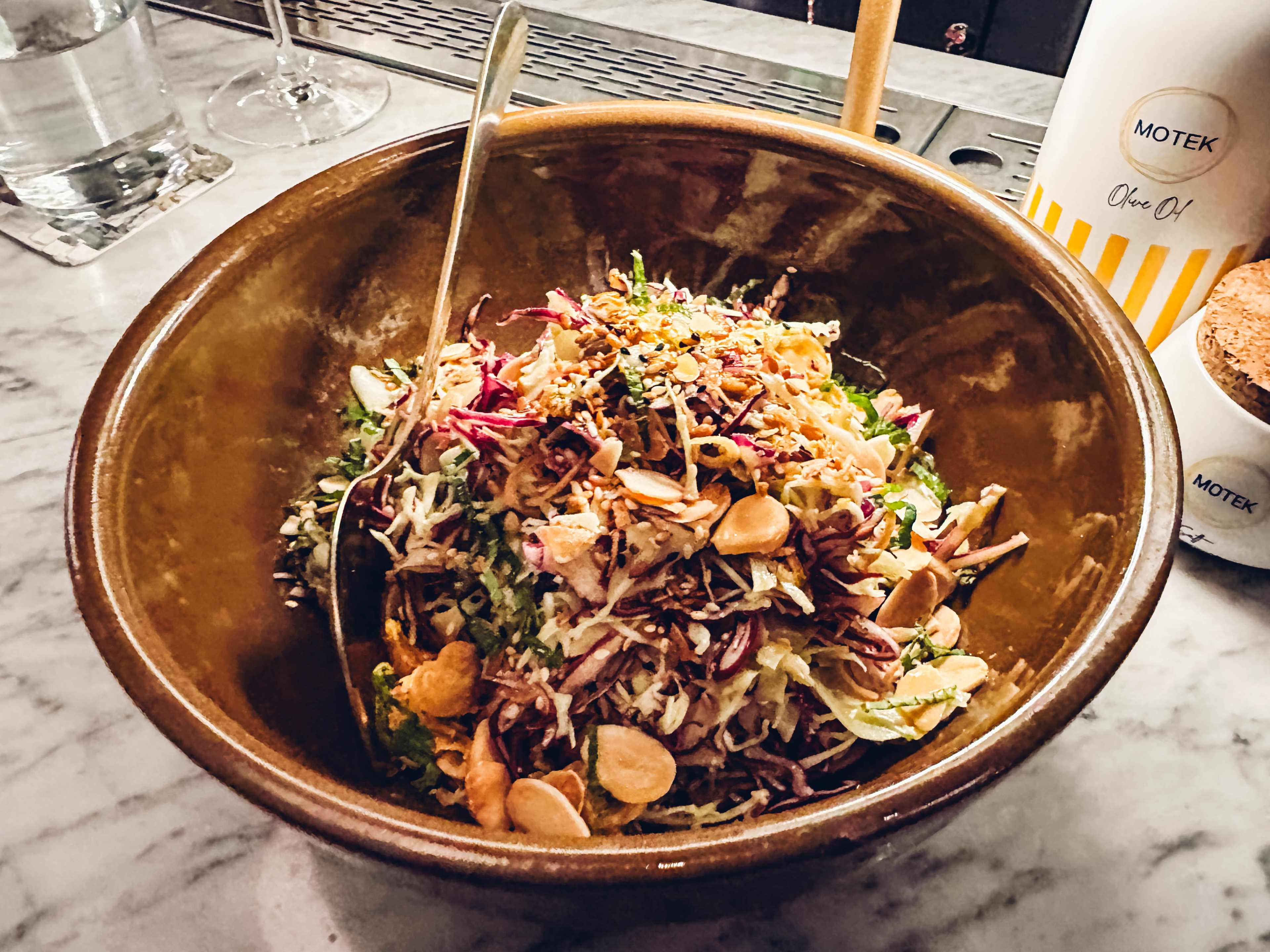 A cabbage salad with almonds.